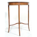 An Edwardian mahogany hall side table having an oval top with a diamond veneer and satinwood