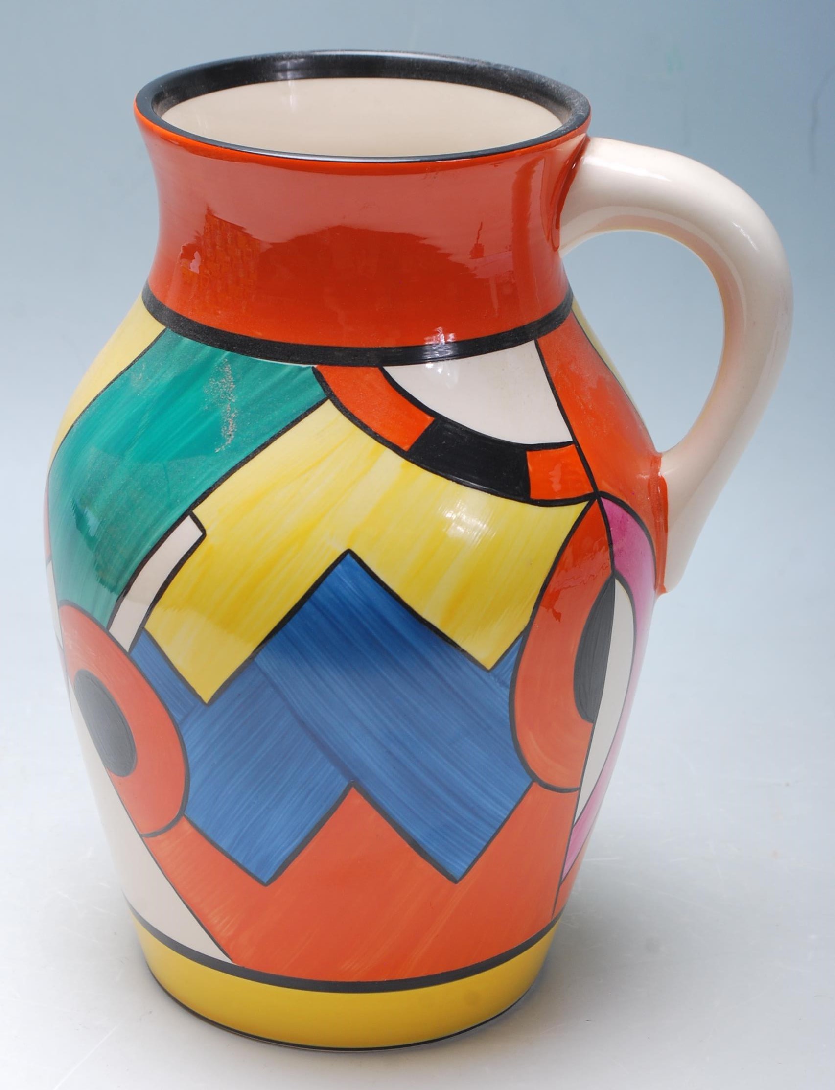 A Wedgwood Bizarre by Clarice Cliff Blue 'W' jug being hand painted with geometric decoration to the - Image 6 of 14