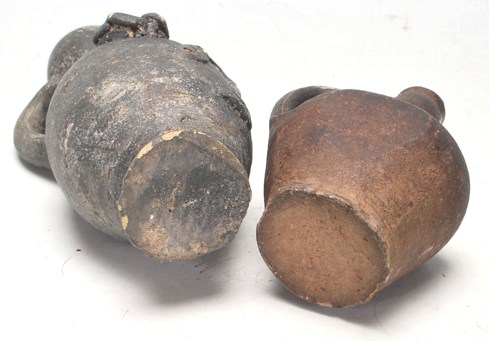 Two antique 16th Century style stoneware hand modelled jugs to to include an oil jug with applied - Image 7 of 7