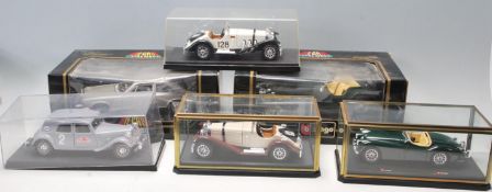 An assorted collection of diecast toy models to include BBurago & Ertl. All appear in mint