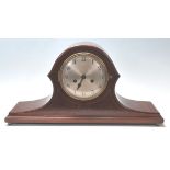 An early 20th Century Edwardian mahogany napoleon's hat mantel clock having inlaid borders with a