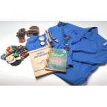 A quantity of vintage 20th Century girl guide related items to include belt, whistle, fabric badges,