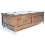 A vintage 20th century 1940’s oak ' under the bed ' blanket box chest. The top  with 3/4 hinged lift