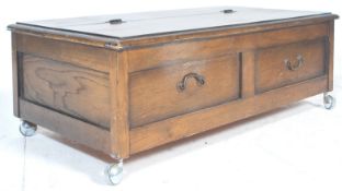 A vintage 20th century 1940’s oak ' under the bed ' blanket box chest. The top  with 3/4 hinged lift