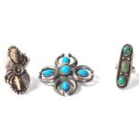 A group of silver white metal Native American Navajo rings to include one floral design ring set