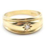 A hallmarked 9ct gold gypsy ring being set with a round cut white stone in a star setting. Assay