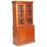 A good George III revival 20th century mahogany library bookcase cabinet having a carved frieze