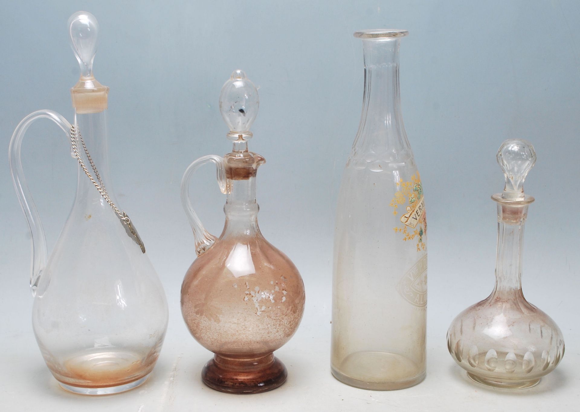 A collection of 18th century and 19th century Victorian glass decanters to include a two jug - Image 2 of 5