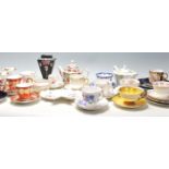 A collection of mixed vintage 20th Century mostly English china tea cups to include a Shelley rose