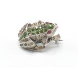 A vintage 20th Century brooch in the for of a frog being set with multi coloured stones. Weight