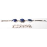 A pair of silver  bracelets, one having 3 lapis lazuli style cabochons and the other having a