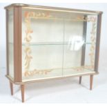 A 1930's Art Deco display cabinet / vitrine of small proportions with double sliding doors,