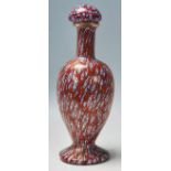 A 20th Century Italian Venetian Murano glass millefiori stoppered bottle vase having a red ground