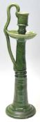 A vintage retro 20th Century studio art pottery green glazed candlestick holder having a round