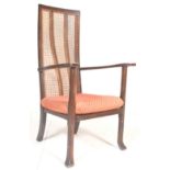 An Art Deco 1930's mahogany high backed bergere fireside chair / armchair. The caned back  with
