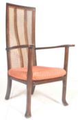 An Art Deco 1930's mahogany high backed bergere fireside chair / armchair. The caned back  with