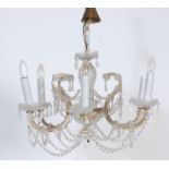 A 20th Century Italian cut glass ceiling chandelier having six branch arms with faux electric