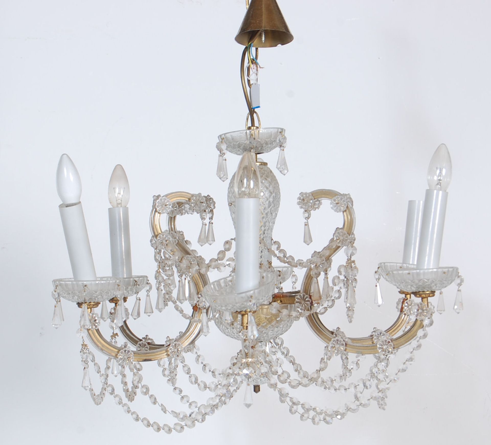 A 20th Century Italian cut glass ceiling chandelier having six branch arms with faux electric