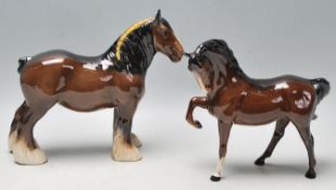 Two 20th Century Beswick ceramic horse figurines to include a brown shire horse with a braided