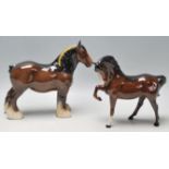 Two 20th Century Beswick ceramic horse figurines to include a brown shire horse with a braided