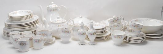 A large vintage fine bone china dinner service by Mayfair comprising of tea cups, coffee cups,