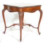 A Victorian 19th century mahogany side / occasional table having carved serpentine edges raised on