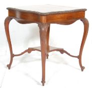 A Victorian 19th century mahogany side / occasional table having carved serpentine edges raised on