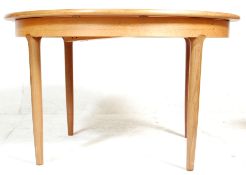 Meredew - British modern design. A 1970's retro vintage teak wood oval extending dining table raised