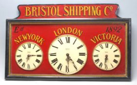 A 20th century wooden painted Victorian style ' Bristol Shipping ' triple clock bearing notation for