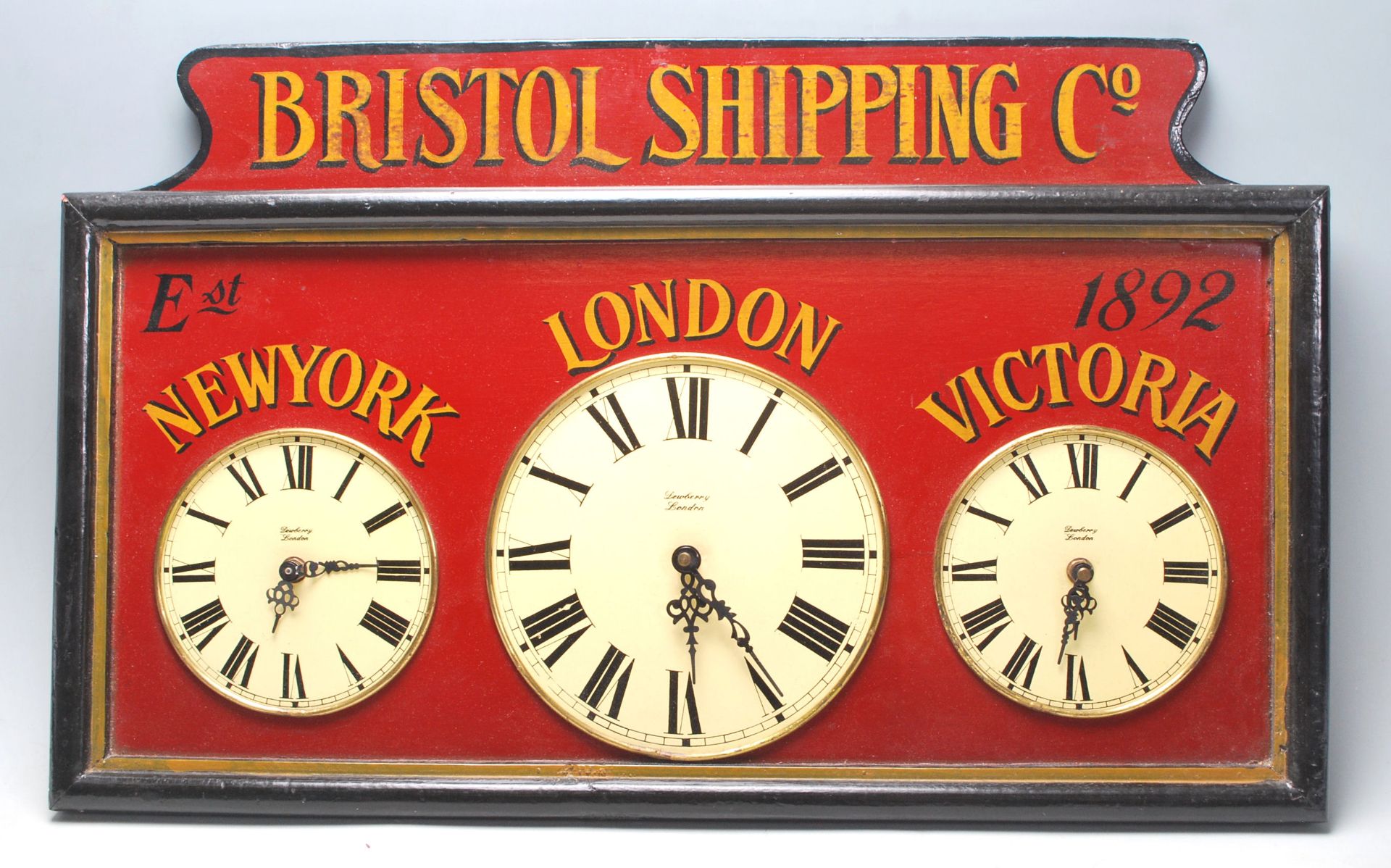 A 20th century wooden painted Victorian style ' Bristol Shipping ' triple clock bearing notation for