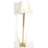 A good Victorian style brass floor standard lamp. The standard lamp with a square base raised on