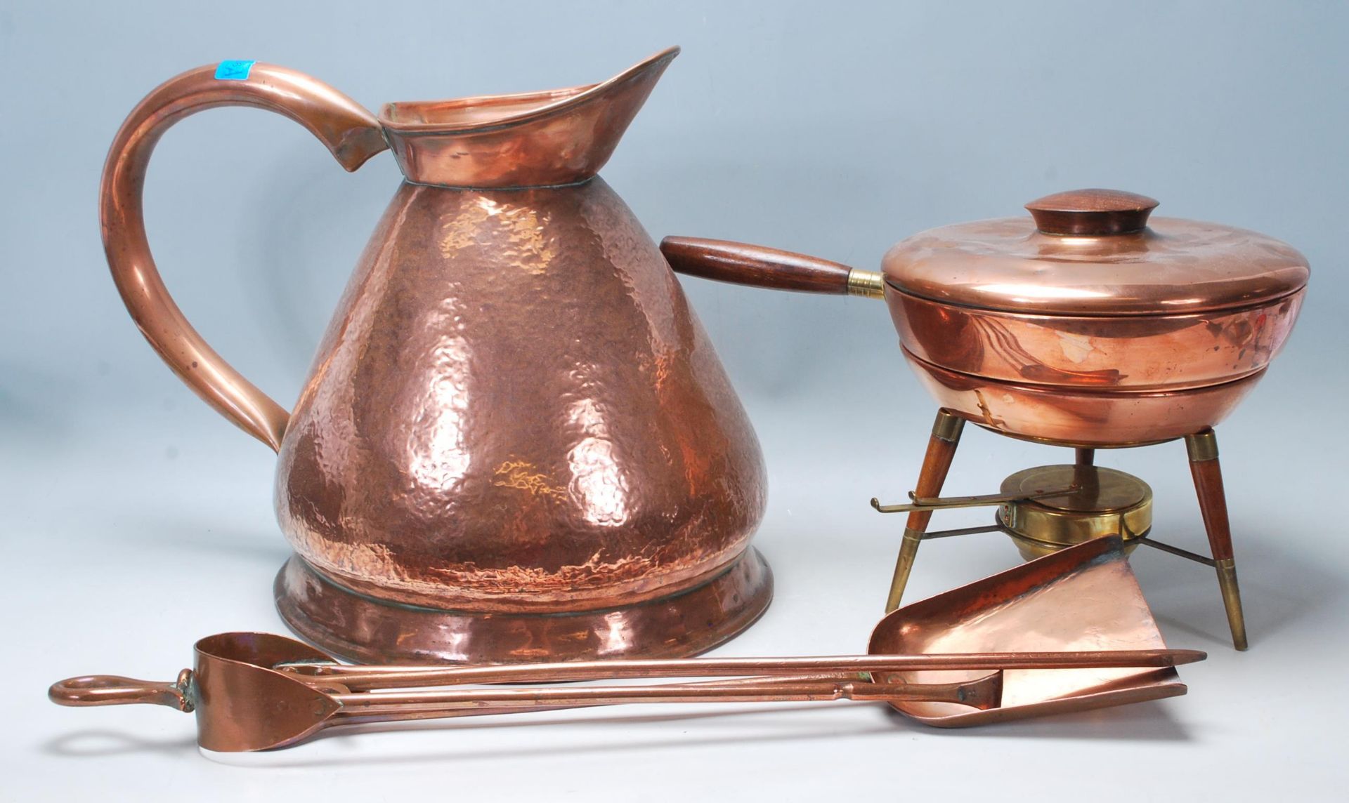 A collection of 20th century copper items to include an Italian portable camping stove, raised on