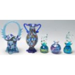 A collection of Murano and Mdina glass to include a pair of horse head paper weights, flower