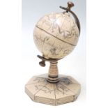 A mid 20th Century “ A Map of the World “ desktop globe with engraving map, ships and mythical