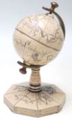 A mid 20th Century “ A Map of the World “ desktop globe with engraving map, ships and mythical