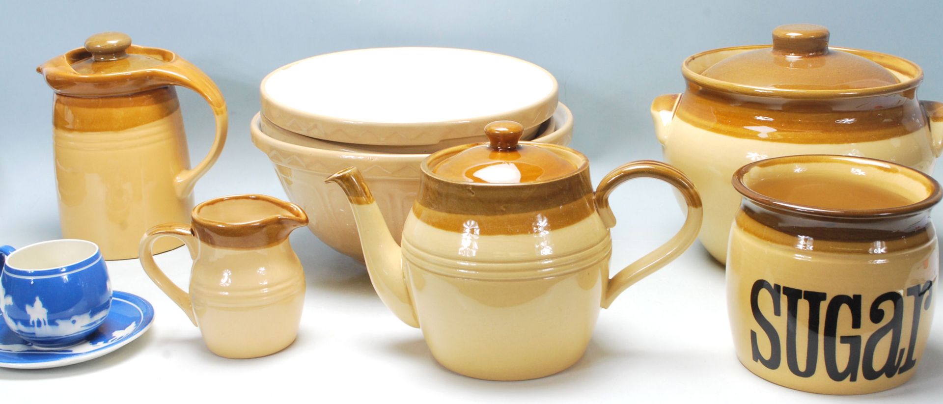 A collection of retro vintage mid century kitchenalia to include a ceramic kettle, jug, sugarpot,