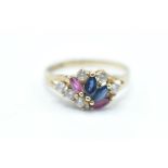 A hallmarked 9ct gold ladies cluster ring being set with blue and pink marquise cut stones with