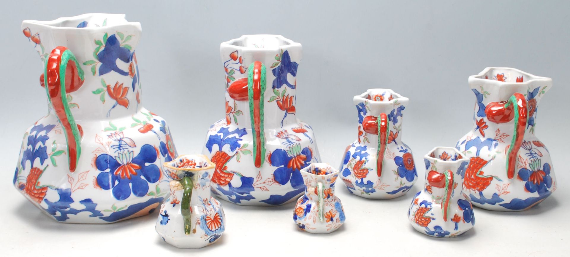 A group of seven early 19th Century graduated Mason patent Ironstone China jug having colourful - Image 2 of 4