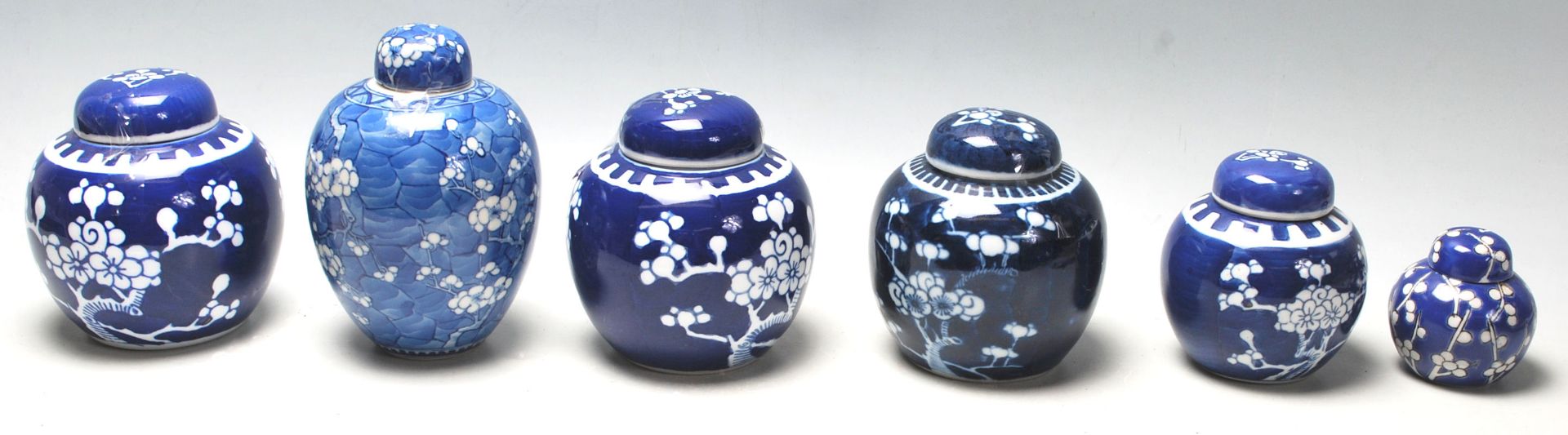 A group of 20th Century hand painted Chinese blue and white ginger jars of bulbous form al being