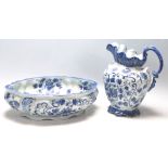 A 20th Century Victorian ironstone ceramic blue and white jug and bowl / pot having floral sprays