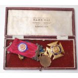 A pair of early 20th century Masonic 9ct gold and enamel medals presented to Bro. H. W. Wedlock 23