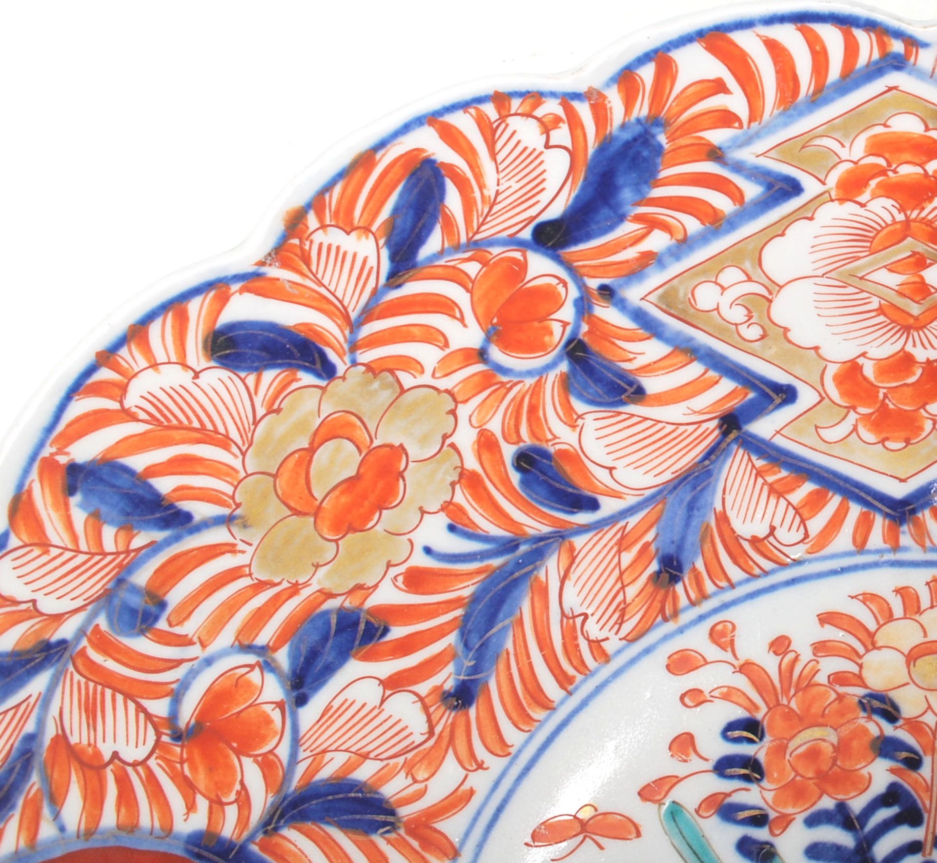 A 19th Century Japanese Imari charger plate with scalloped rim, typical decoration with a vase of - Image 2 of 6