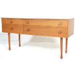 A vintage mid 20th Danish inspired teak wood sideboard/chest of drawers, having four drawers
