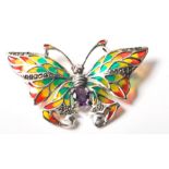 A stamped .925 sliver ladies brooch in the form of a butterfly with amethyst and plique a jour