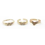 A group of three 9ct gold ladies rings to include a three tone wishbone ring (hallmarked 375), a