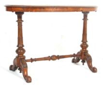 An antique 19th Century Victorian figured walnut writing table desk. The oval top with inlaid border