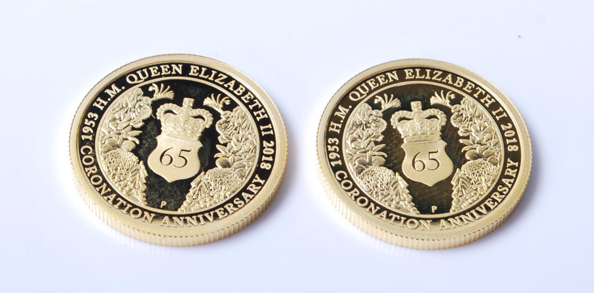 A pair of 1/4 ounce 24ct gold coins by the Perth Mint commemorating the 65th Queens Jubilee. Each