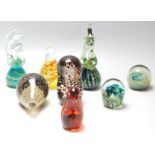 A good collection of eight mid century vintage retro studio art glass paperweights to include: