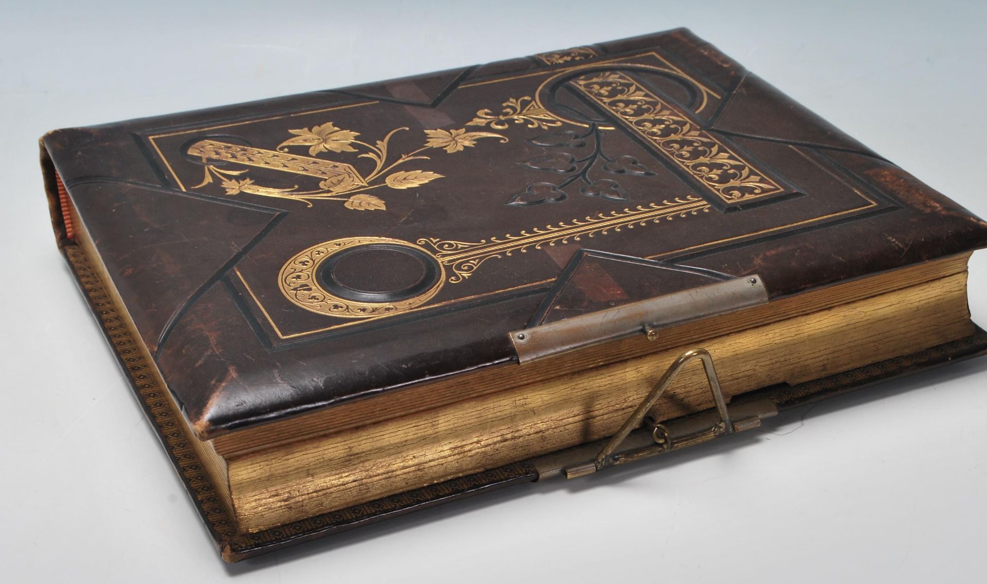 A Victorian 19th Century leather bound and gilt tooled musical photographic album with the songs