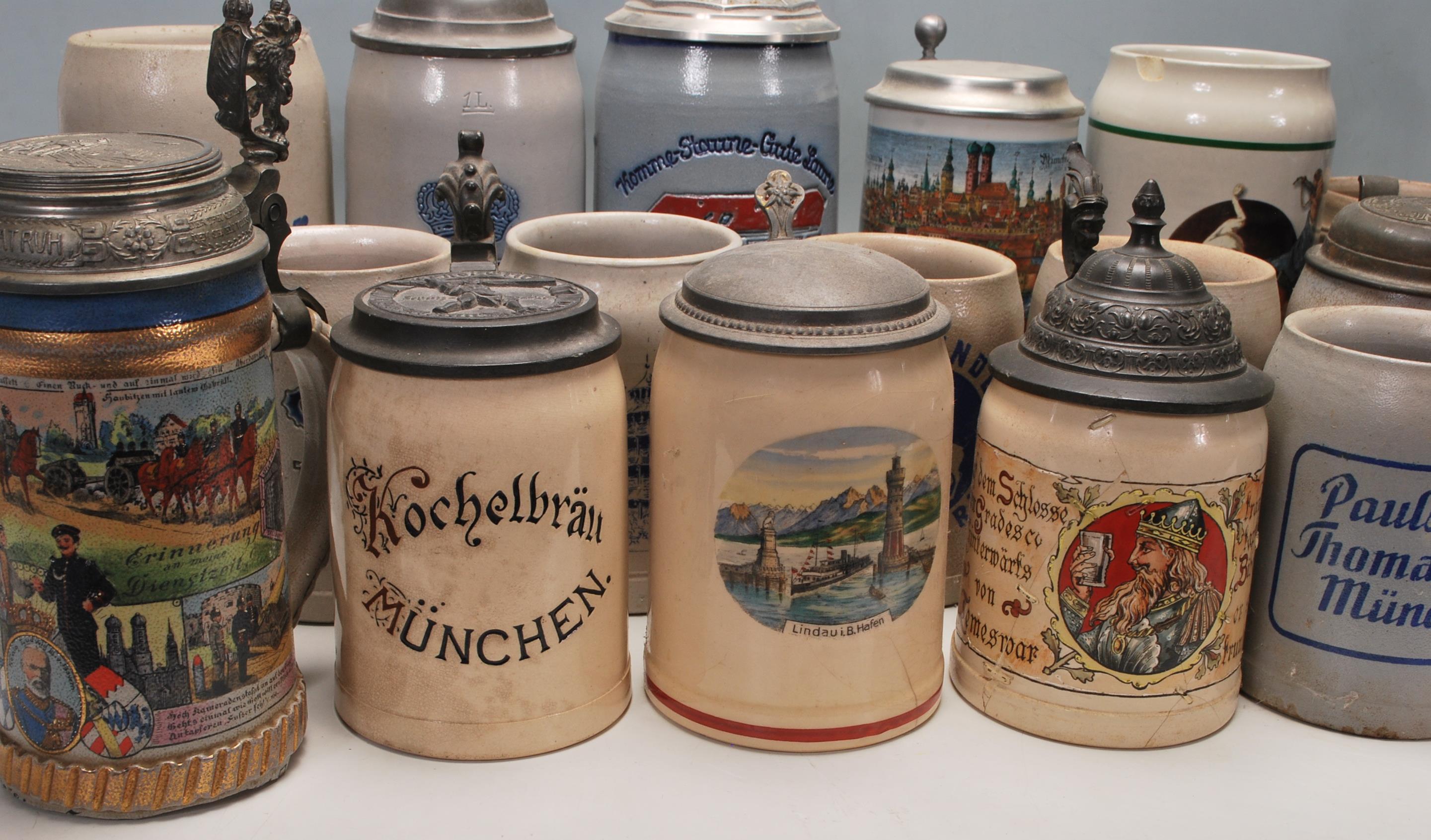 A large collection of German blue and grey stoneware jugs and beer steins, some having pewter - Image 2 of 10